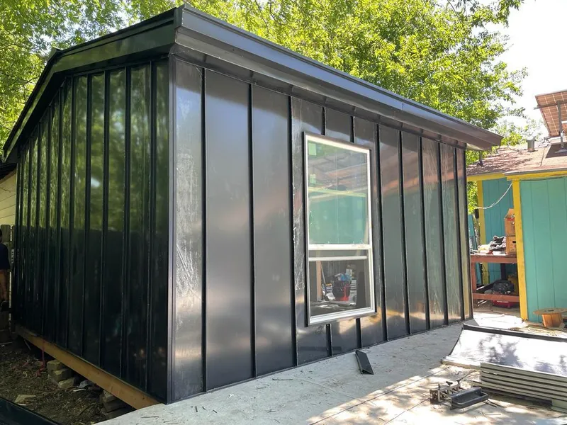 Black standing seam metal wall panels for Metal Roof Installation in Bern